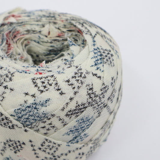 Black, blue, and red ikat pattern on white wool (Y02402011)