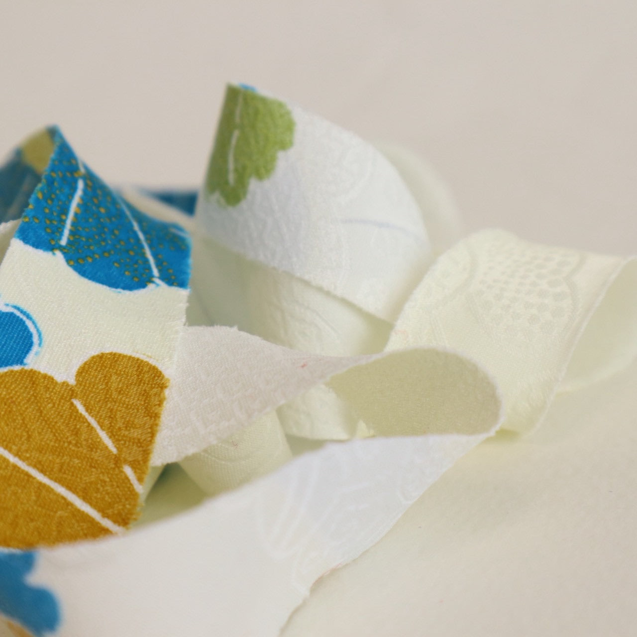 Light cream with red, green, blue, and yellow floral pattern, synthetic fiber (Y02601004)