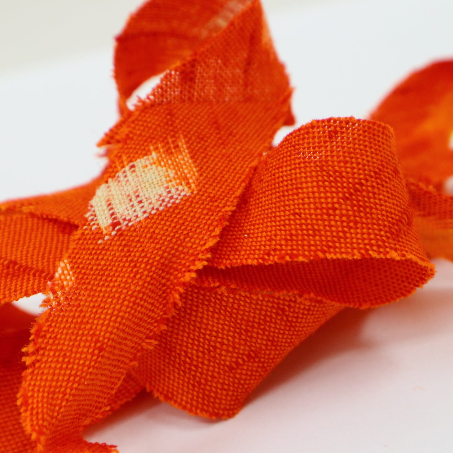 Red-orange with yellow and white kasuri pattern, wool (Y02406001)