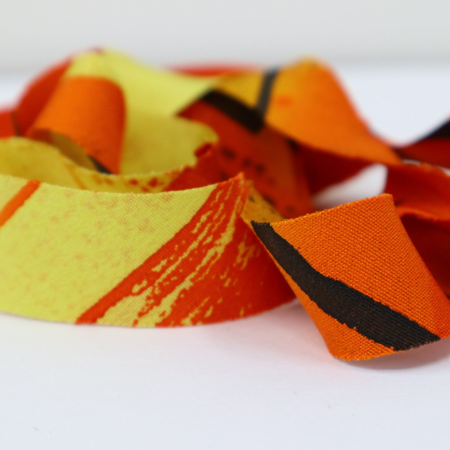 Orange with dark brown and yellow abstract pattern, crepe (Y02403012)