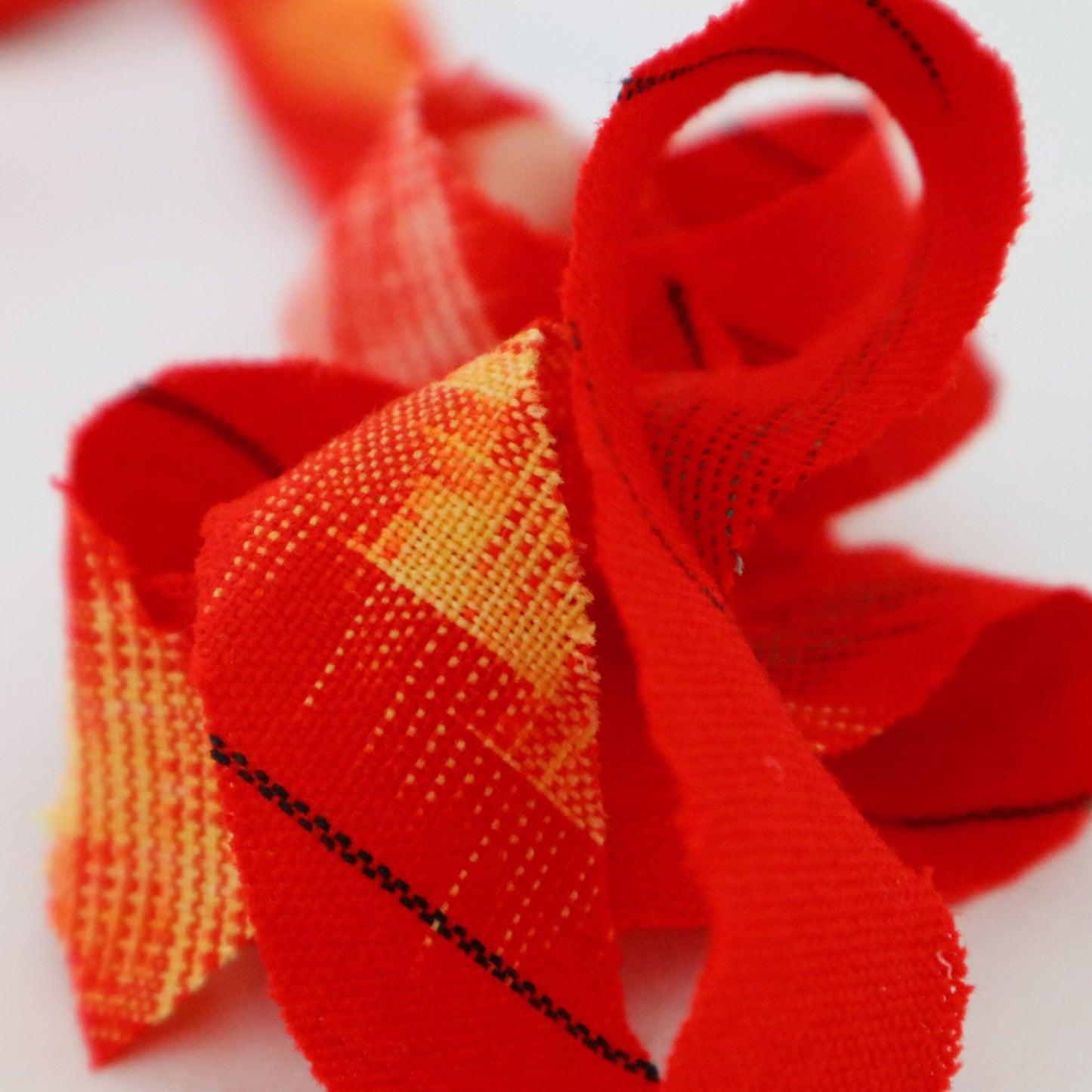 Red with yellow, white, and black ikat pattern, wool (Y02211006)