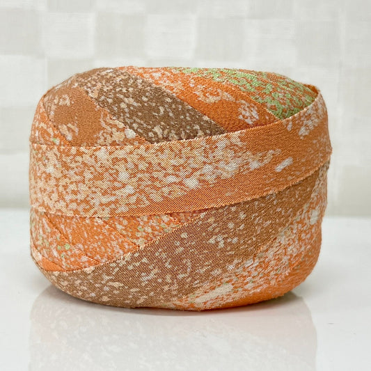 Pale orange with green and brown gradation, crepe (Y02003029)