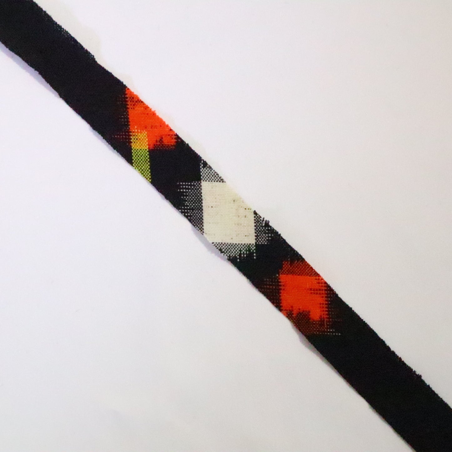 Black with white, orange and yellow geometric pattern, wool (Y02310010)