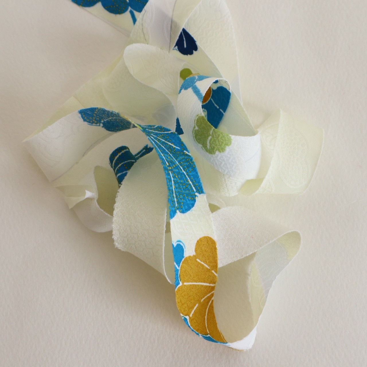 Light cream with red, green, blue, and yellow floral pattern, synthetic fiber (Y02601004)