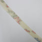 White tsumugi with autumn leaf pattern in pink, light blue, and yellow-green (Y02305009)