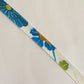 Light cream with red, green, blue, and yellow floral pattern, synthetic fiber (Y02601004)