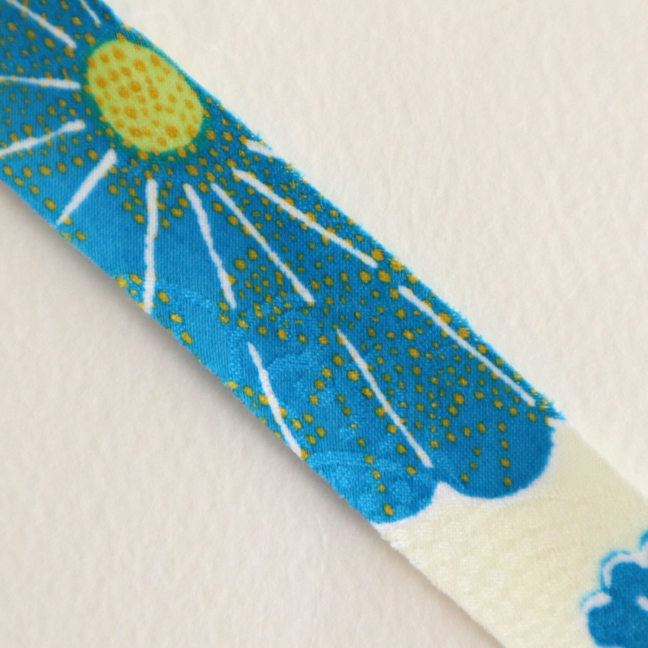 Light cream with red, green, blue, and yellow floral pattern, synthetic fiber (Y02601004)