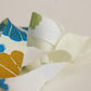 Light cream with red, green, blue, and yellow floral pattern, synthetic fiber (Y02601004)