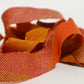 Orange, brick, and brown gradation with mixed weave (Y02601008)