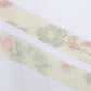 White tsumugi with autumn leaf pattern in pink, light blue, and yellow-green (Y02305009)