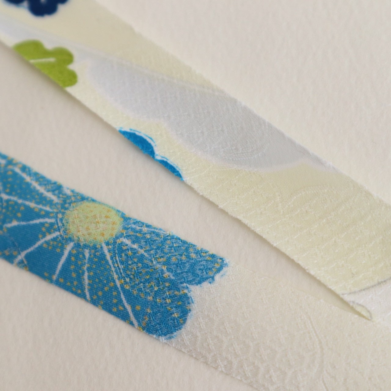Light cream with red, green, blue, and yellow floral pattern, synthetic fiber (Y02601004)