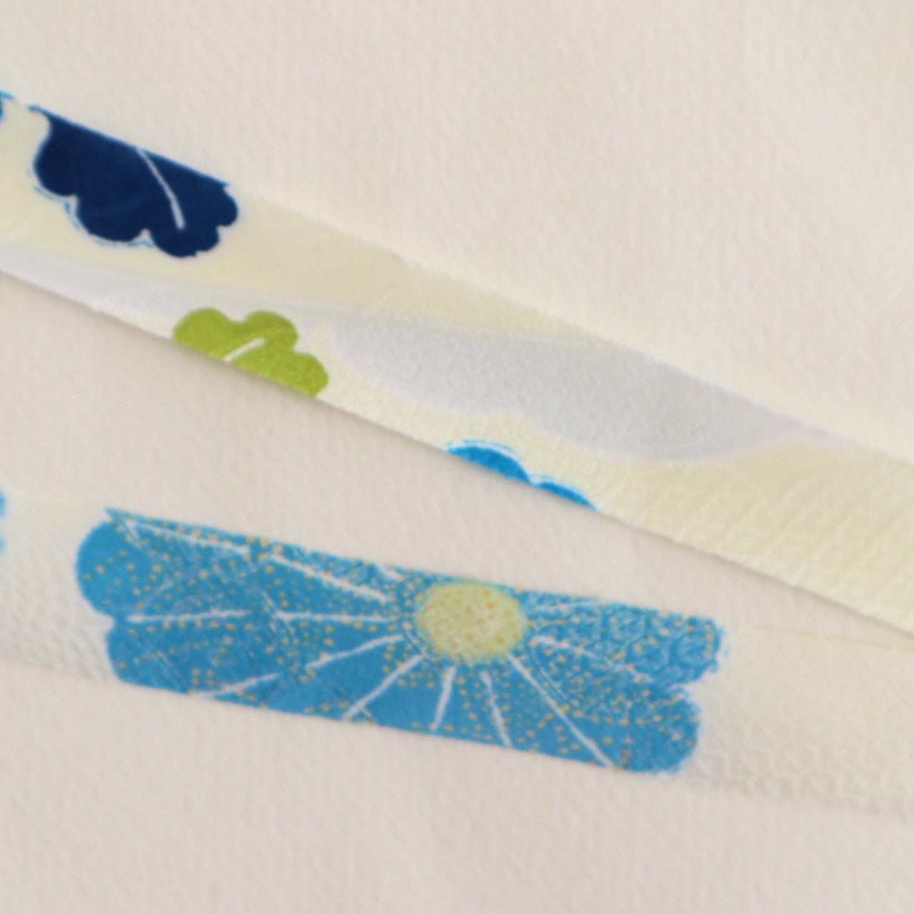 Light cream with red, green, blue, and yellow floral pattern, synthetic fiber (Y02601004)