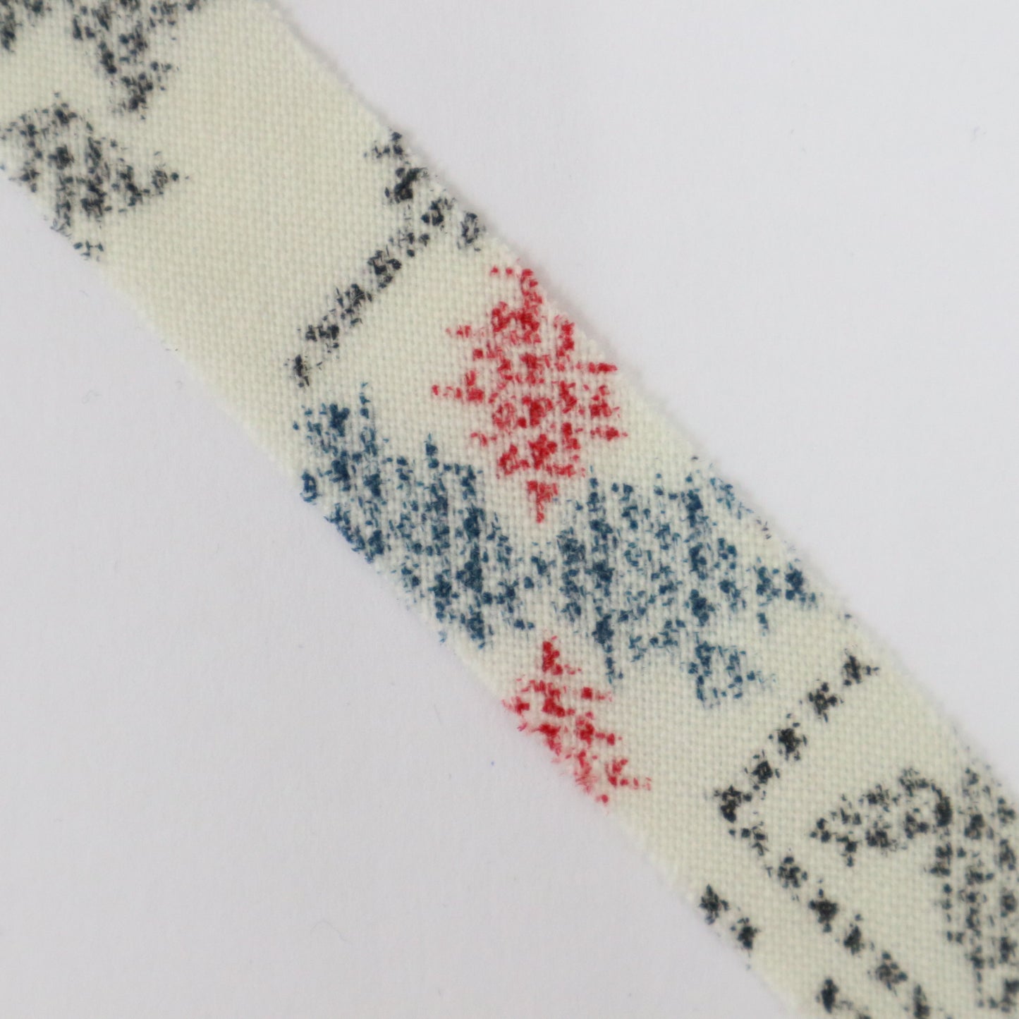 Black, blue, and red ikat pattern on white wool (Y02402011)