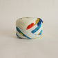 Light cream with red, green, blue, and yellow floral pattern, synthetic fiber (Y02601004)