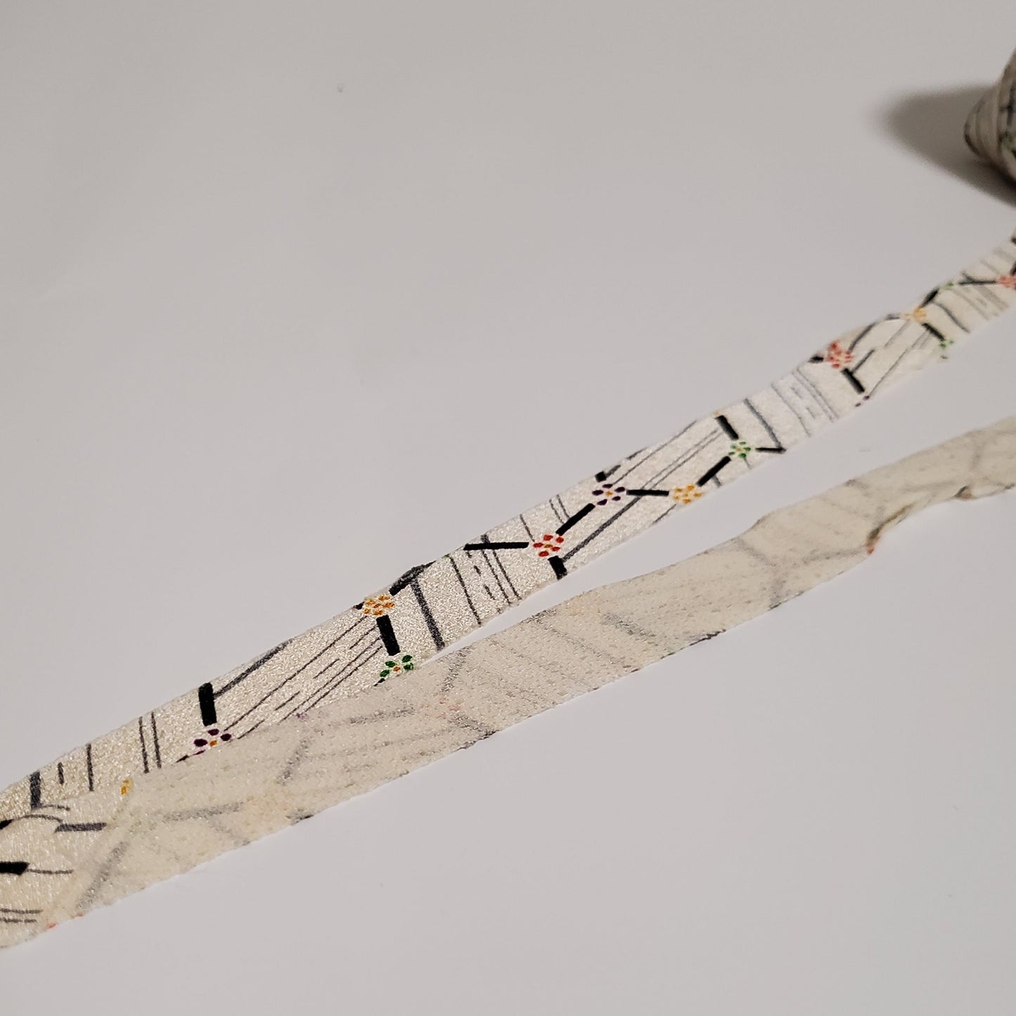 Gray abstract pattern on a white background, yellow, red, purple and green florets (Y00010182)