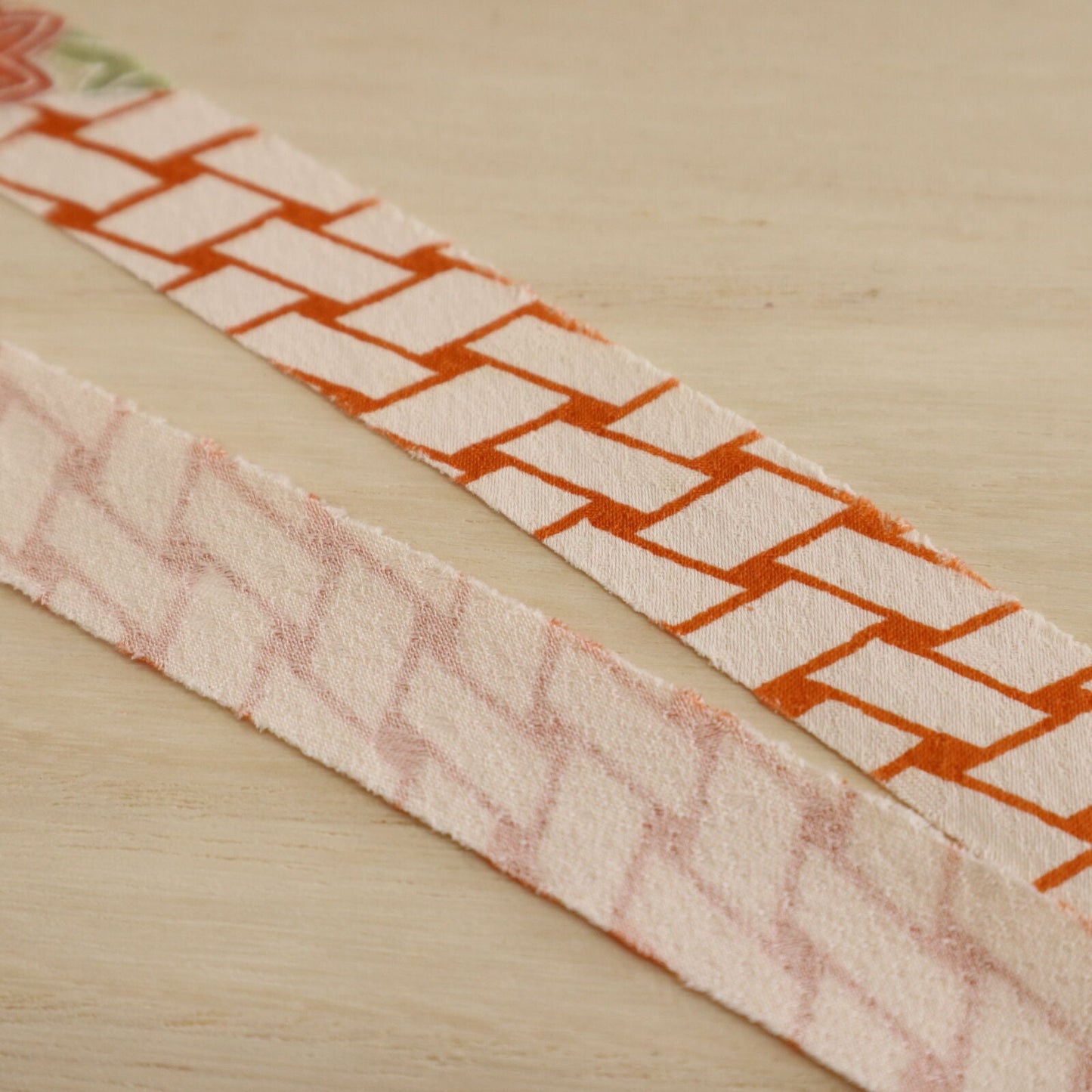 Orange wickerwork pattern on a white background with autumn leaves, plum and crepe (Y02008060)