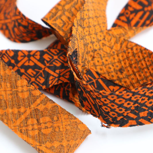 Orange pique and rhombus pattern on black, crepe (Y02009109)