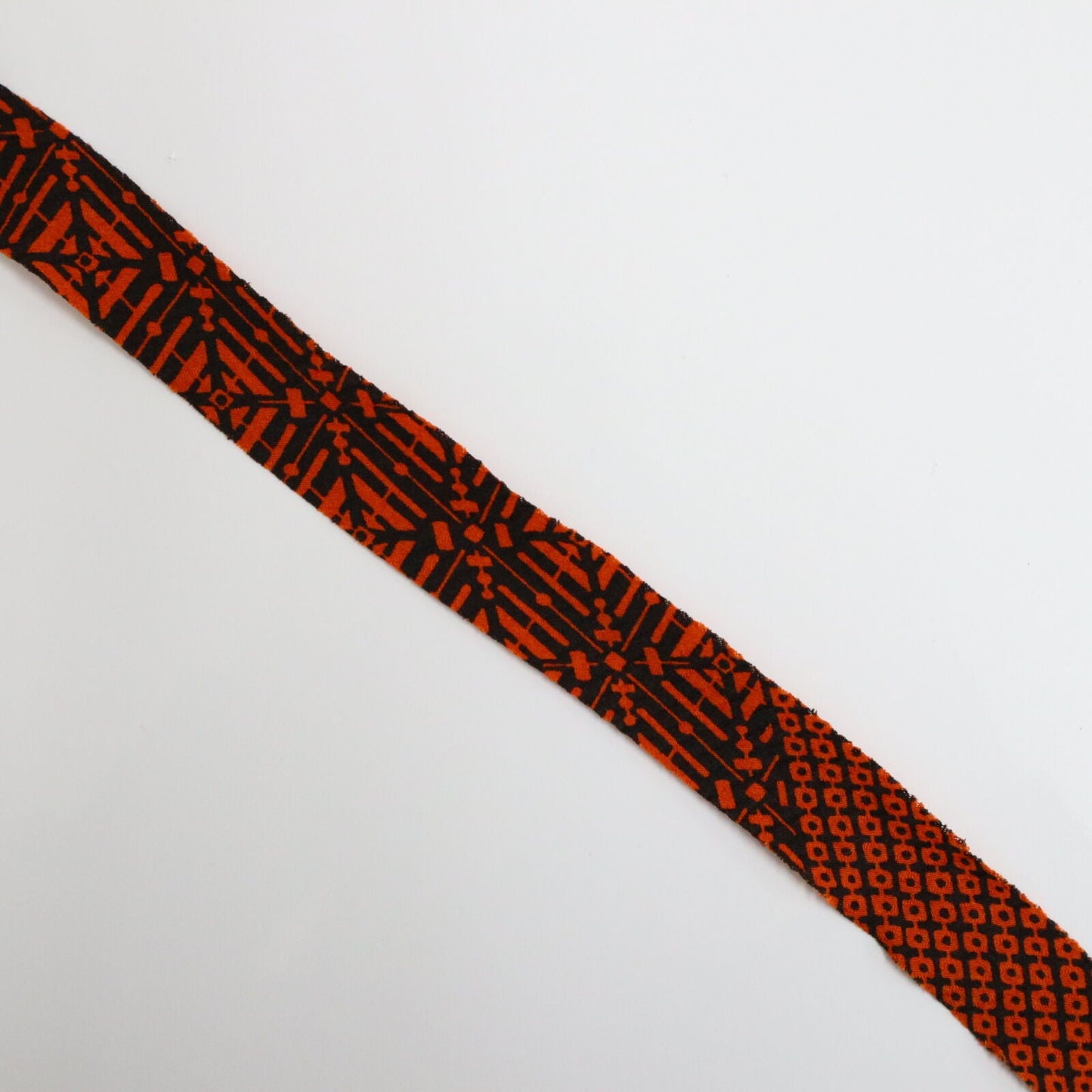 Orange pique and rhombus pattern on black, crepe (Y02009109)