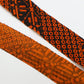 Orange pique and rhombus pattern on black, crepe (Y02009109)