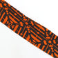 Orange pique and rhombus pattern on black, crepe (Y02009109)