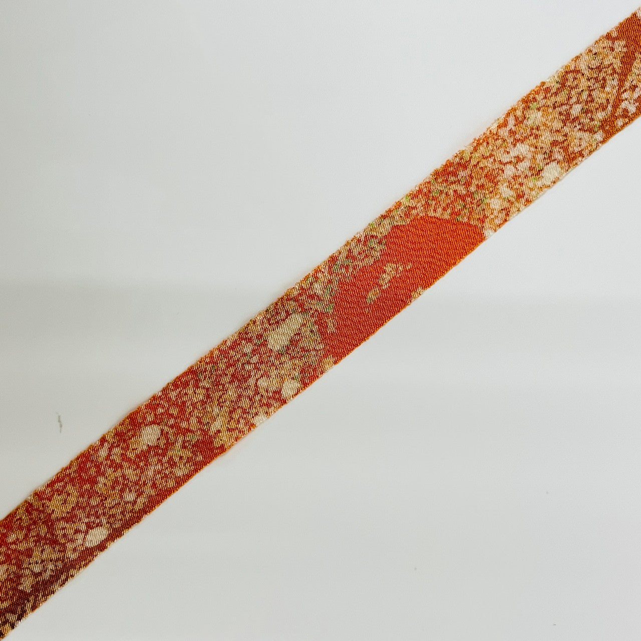 Pale orange with green and brown gradation, crepe (Y02003029)